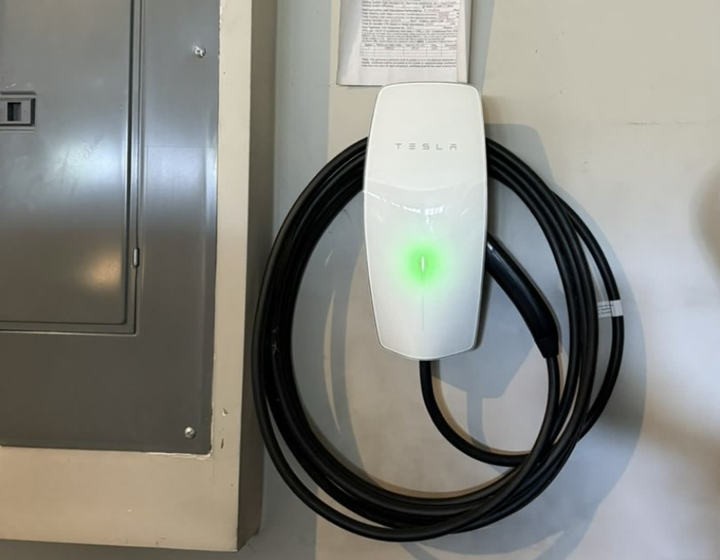 Tesla Wall Connector installed beside the main panel
